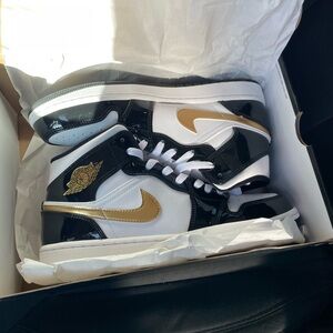 Air Jordan Mid 1 Black and Gold Sneakers